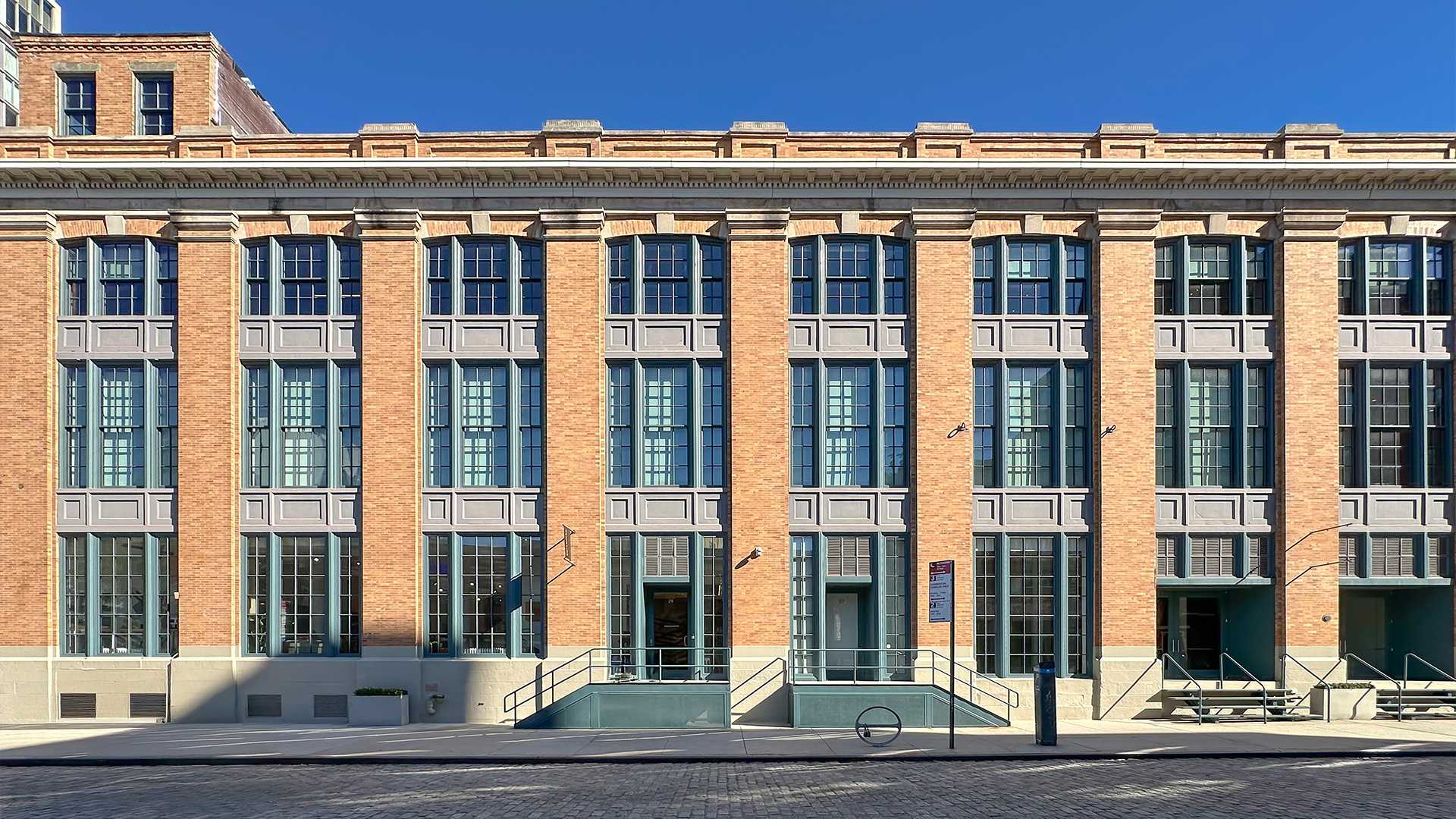 Straight on view of the 416 West 13th Street from the Little West 12th Street side of the property.